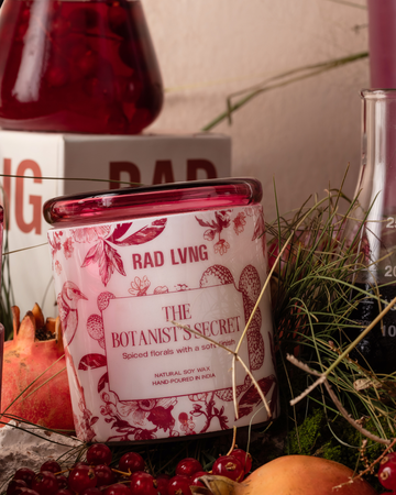 Elixir of Hidden Blooms botanical candle with musk, soft spice and ambered vanilla base note
