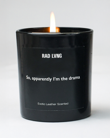 Exotic leather scented candle in frosted glass jar – luxury home fragrance for modern decor.